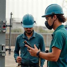 Field team surveying mobile signal